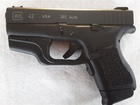 Glock 42 with Crimson Trace red laser1.jpg